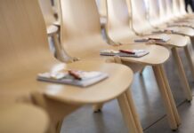 Organising a Conference Requires You to be Tough white ceramic mug on brown wooden table