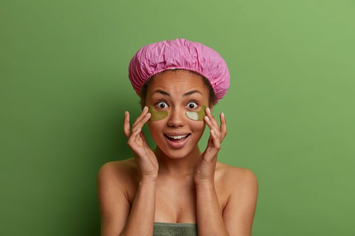 A person wearing a purple hat Description automatically generated