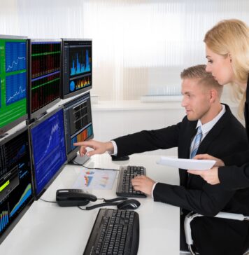 Is that company safe to invest in? What to look for A picture containing text, person, indoor, working Description automatically generated