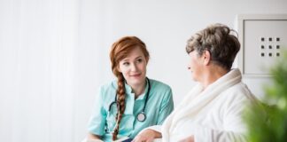 Using a medical qualification in different healthcare settings A doctor talking to a patient Description automatically generated with medium confidence