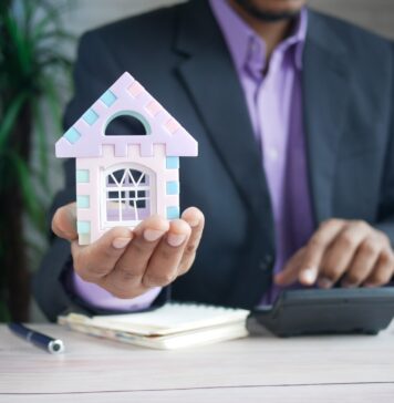 Mortgage Cheat Sheet: Lender Mr. Cooper on the Need-to-Know When Applying for a Mortgage man in purple suit jacket using laptop computer