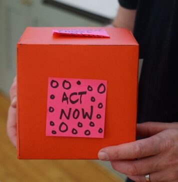 5 Non-Profit Fundraising Ideas person holding red box