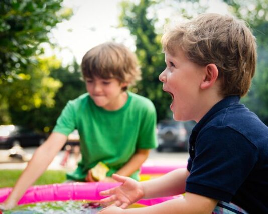 How the Child Tax Benefit Became the Canada Child Benefit boy in blue shirt screaming near boy in green crew-neck shirt