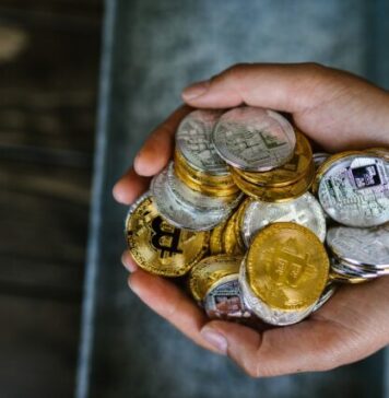 The Significance of Know Your Customer (KYC) for Cryptocurrency Exchanges Person Holding Gold and Silver Coins