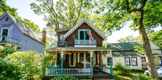 Things to look for when buying a house white and brown wooden house surrounded by green trees during daytime