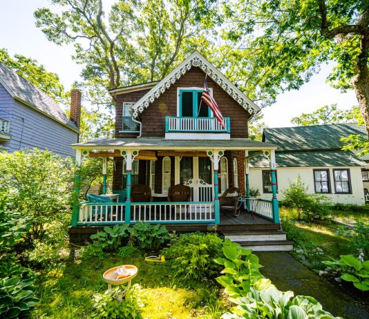 Things to look for when buying a house white and brown wooden house surrounded by green trees during daytime