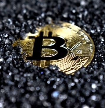 Financial independence by Quantum AI gold and black round emblem