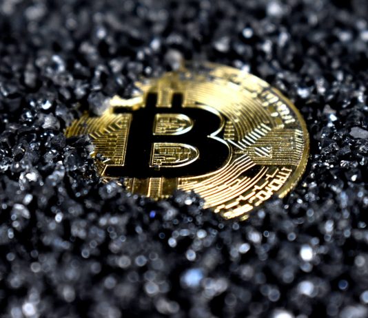 Financial independence by Quantum AI gold and black round emblem