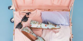 5 Summer Essentials You Need in Your Wardrobe clothing items and pair of shoes in luggage