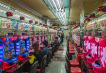 How Does A Live Casino Work? people sitting on red plastic chairs inside building