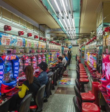 How Does A Live Casino Work? people sitting on red plastic chairs inside building