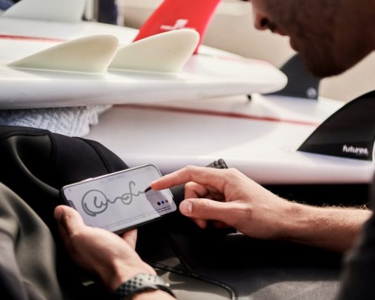 A Concise Guide to Home Purchase for Dummies man working remotely signing contract on DocuSign