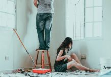 Living on ROI Street: 8 Elements That Can Increase the Resale Value of Your Custom Home woman in gray tank top and blue denim jeans sitting on bed