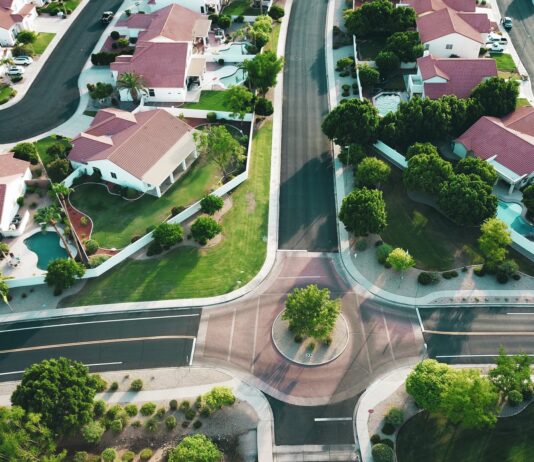 The Pros and Cons of Investing in Commercial Real Estate white-and-red houses