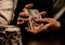 The 5 Best Casino Games to Try Today person holding king of spade playing card