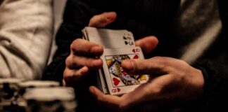 The 5 Best Casino Games to Try Today person holding king of spade playing card
