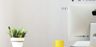 How to Set Up a Home Office for Remote Work yellow ceramic mug beside gray aluminum iMac