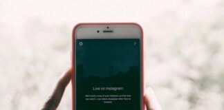 How Instagram Can Help Grow Your Business person holding iPhone