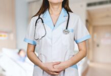 Types of Medicare Insurance plans woman in white button up shirt and blue stethoscope