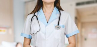 Types of Medicare Insurance plans woman in white button up shirt and blue stethoscope