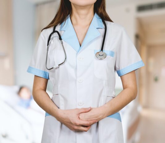 Types of Medicare Insurance plans woman in white button up shirt and blue stethoscope