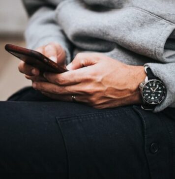 5 Reasons to Visit Australian Live Casino Online person in gray sweater wearing black and silver chronograph watch