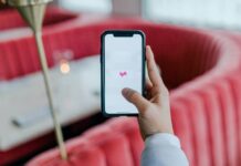 Why should you use the Melbet app? black smartphone