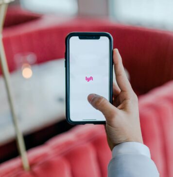 Why should you use the Melbet app? black smartphone