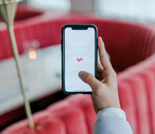 Why should you use the Melbet app? black smartphone