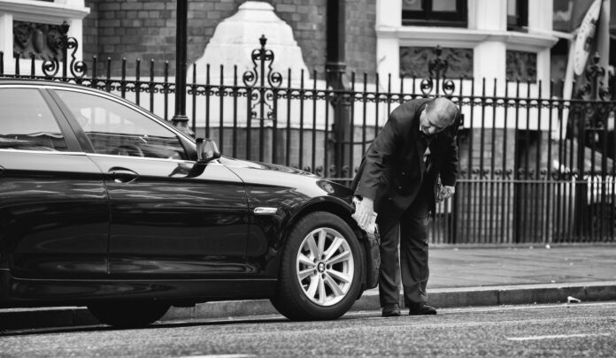 Photo by Anders Nord man holding vehicle tire