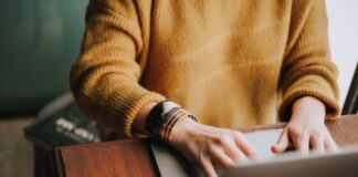 Mostbet App Apk for Android person using laptop computer