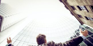 How Ethical Investors Build a Sustainable Portfolio low-angle photography of man in the middle of buidligns