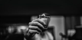 Mind-Blowing Facts About Online Gambling You Probably Didn’t Know man holding 1 US dollar banknote