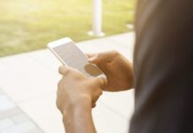 Why Indians Prefer Mobile Gambling Nowadays person holding post-2014 iPhone