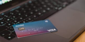 Cashback or Bonuses on Credit Cards: Which Is Better? blue and white visa card on silver laptop computer
