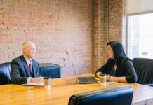 What to Expect When Meeting Your Attorney for the First Time man and woman talking inside office