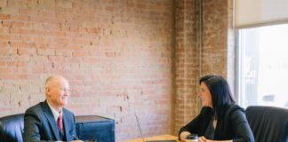 What to Expect When Meeting Your Attorney for the First Time man and woman talking inside office