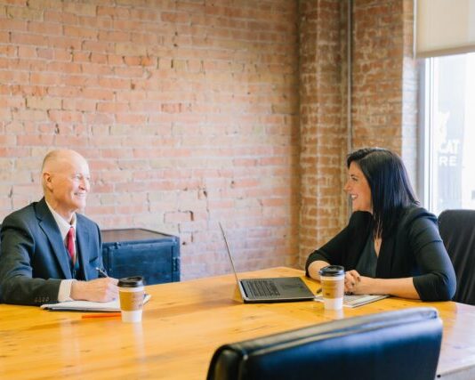 What to Expect When Meeting Your Attorney for the First Time man and woman talking inside office