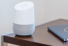 5 Must-Have Tech Devices Every Home Needs for Best Entertainment white and gray Google home on brown table