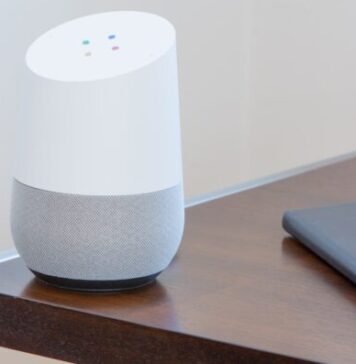 5 Must-Have Tech Devices Every Home Needs for Best Entertainment white and gray Google home on brown table