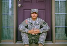 Where to Buy Tactical Pants? woman sitting in front of closed door