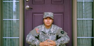 Where to Buy Tactical Pants? woman sitting in front of closed door