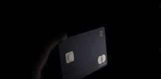 Factors that Affect the Cash Limit on Your Credit Card person holding black card