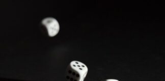 Online Casinos vs Live Casinos: Differences and Similarities 3 white dice on black surface