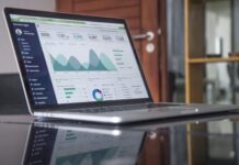 7 Ways Machine Learning and AI Can Improve Your Accounting laptop computer on glass-top table