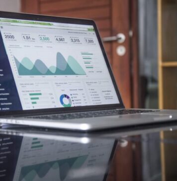 7 Ways Machine Learning and AI Can Improve Your Accounting laptop computer on glass-top table