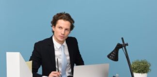 The 5 Steps to Making Your Business More Efficient man sitting on chair beside laptop computer and teacup