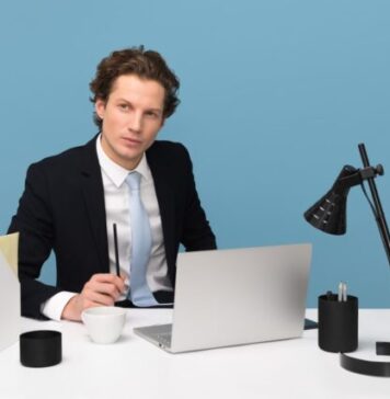 The 5 Steps to Making Your Business More Efficient man sitting on chair beside laptop computer and teacup