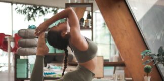 Everything You Need To Crush Your Fitness Goals woman doing yoga