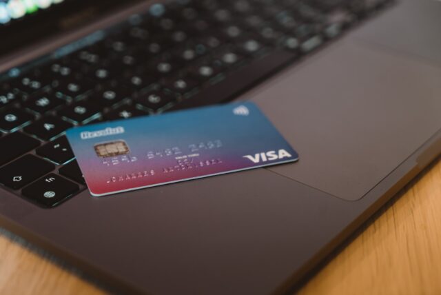 Photo by CardMapr.nl blue and white visa card on silver laptop computer
